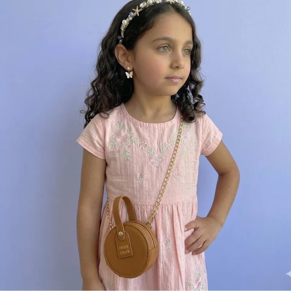 شنطة أطفال دائرية باللون البني